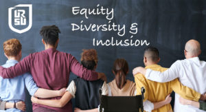 A group of people facing a blackboard with their backs to the viewer. They are side-by-side with their arms on each others' shoulders or hips. On the blackboard in chalk are the words "Equity, Diversity & Inclusion"
